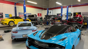 mclaren and porsche in a repair shop Above and Beyond Performance, LLC